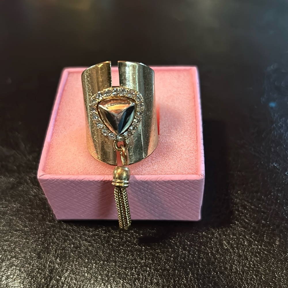 Statement, gold tone and stone ring with dangling chain